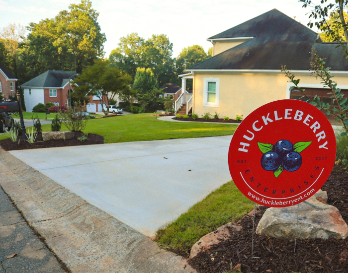 sidewalks and driveways with huckleberry sign